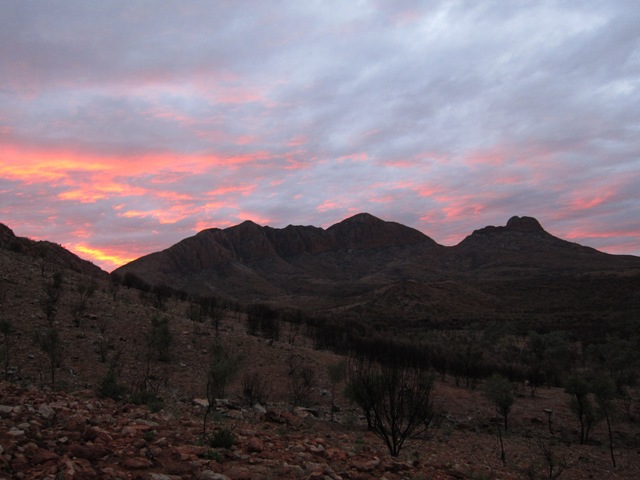 Sunset over Mt Sonder and our view from night 1 camp.JPG
