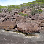 Boulders behid black cliffs (106513)