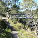 Riverside track passing foot bridge (274022)