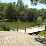 Timber bridge by large pond in Richley Reserve (401575)