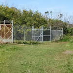 Grassed track around fence (70012)
